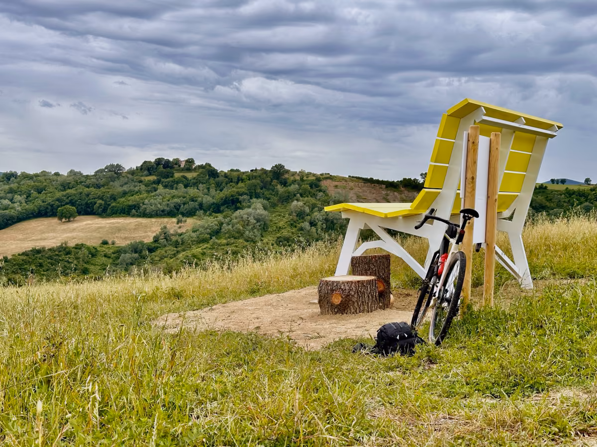 A giant bench in the hills of Montecastrilli at sunset